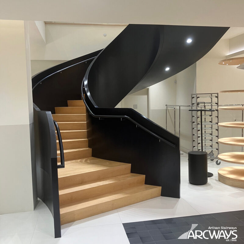 Arcways Commercial Stair: Curved, Modern Stair with Serpentine Balustrade | J.Crew | Spring Street | New York City