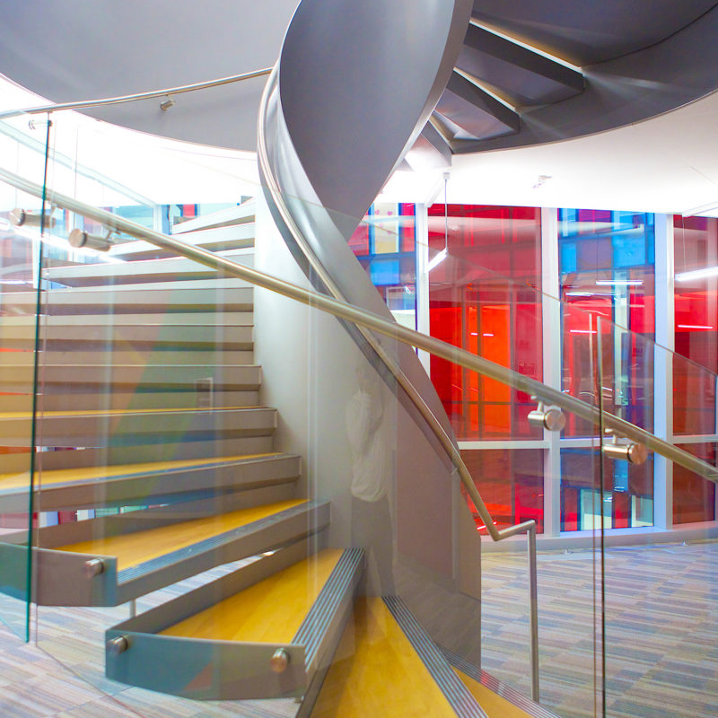 Arcways Custom Stairs: Modern Commercial Helical Spiral Stair in Steel and Glass - University of Baltimore