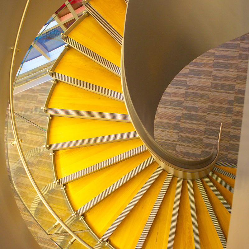 Arcways Custom Stairs: Modern Commercial Helical Spiral Stair in Steel and Glass - University of Baltimore