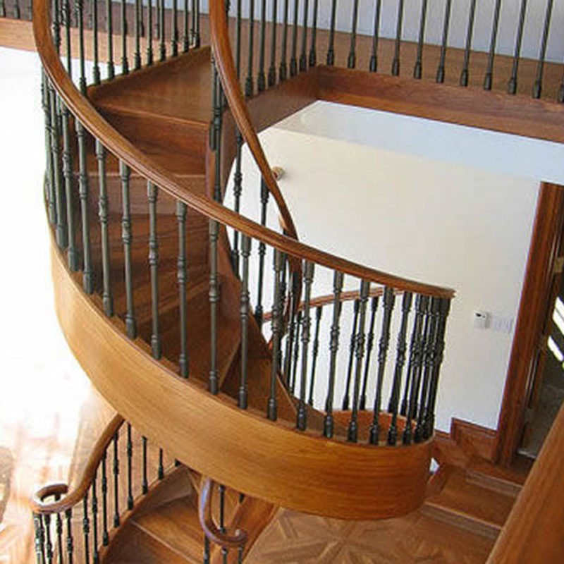 Double Helix Staircase in Black Walnut with Custom Gun Metal Iron Balusters | Aspen, Colorado