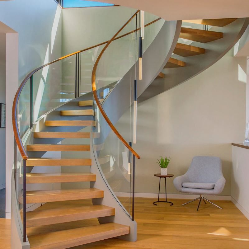 Modern Design Curved Staircase with Glass Railings | Hawaii