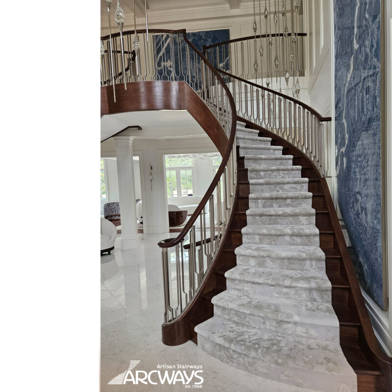 Grand Symmetrical Curved Staircase with Metal Balustrade