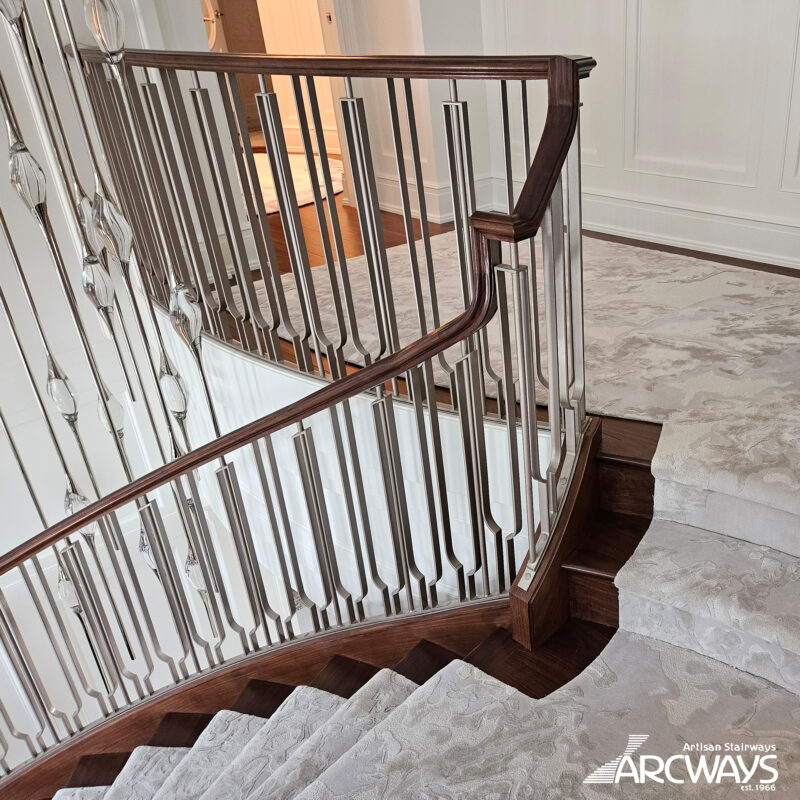 Grand Symmetrical Curved Staircase with Stainless Metal Balustrade