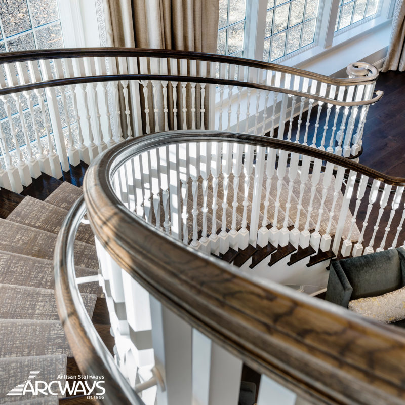 Classical Floating Commercial Curved Stairway with Custom Wood Balusters | Watertown, Massachusetts