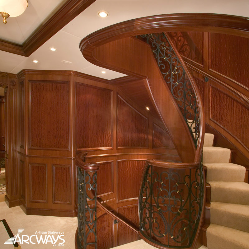 Classical Helical Stair with Custom Millwork and Iron Balustrade in Motor Yacht