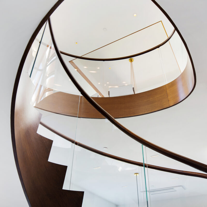 Modern Curved Floating Staircase Design With Glass Balustrade and Integrated Lighting | Seattle, Washington