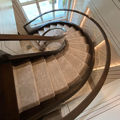 Contemporary Curved Wood and Glass Staircase in New York